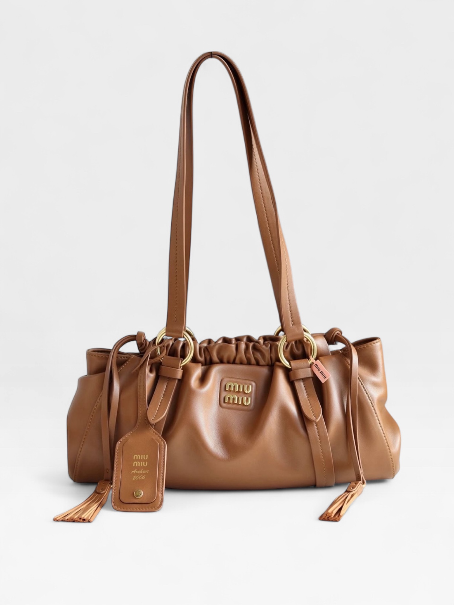 Miu Miu Joie Shoulder Bag is crafted from cognac brown nappa leather